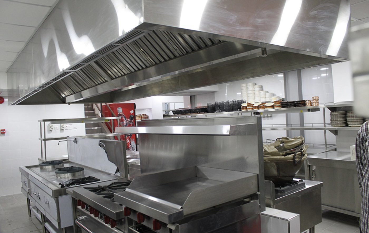 Commercial kitchen at Lanterns Restaurant with extraction canopy, ranges and griddle