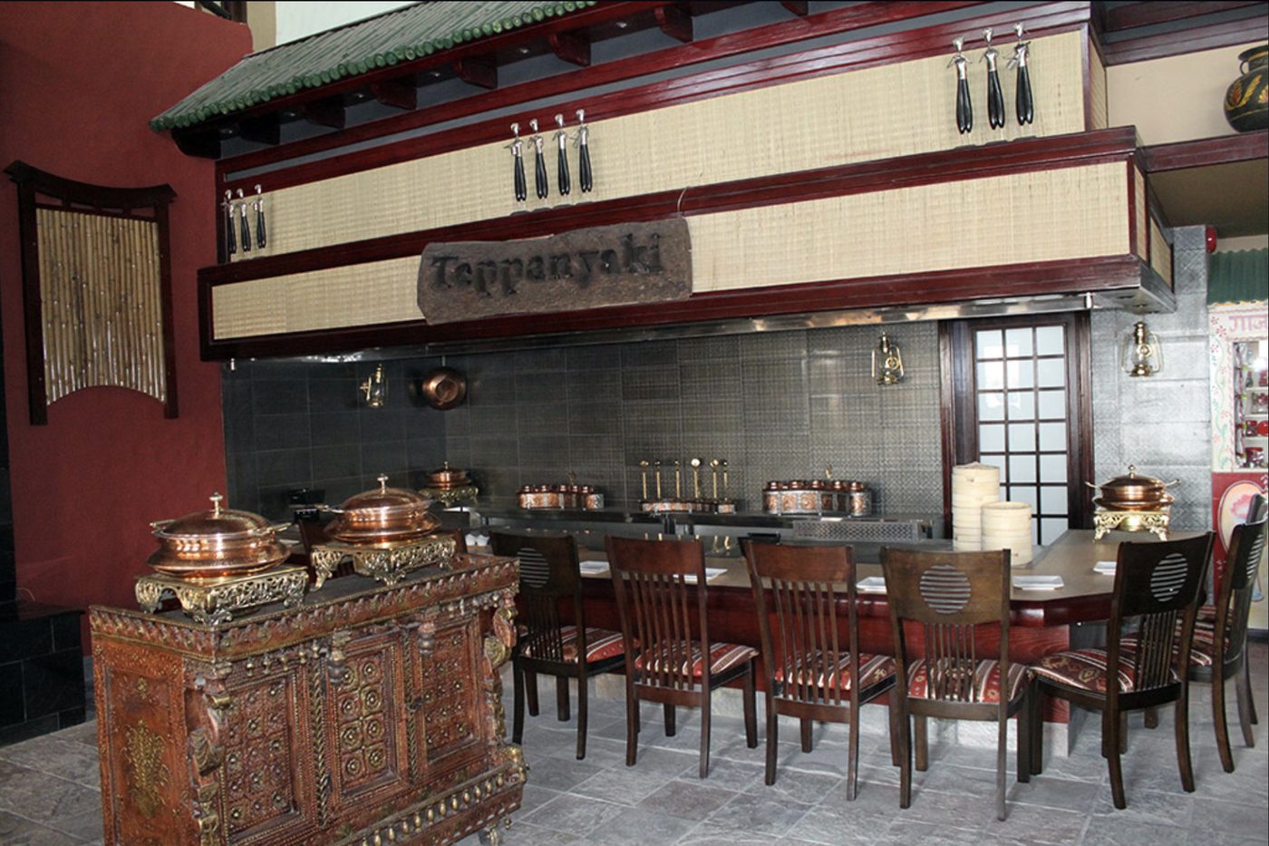 Teppanyaki dining area with seating around the cooking counter at Lanterns Restaurant
